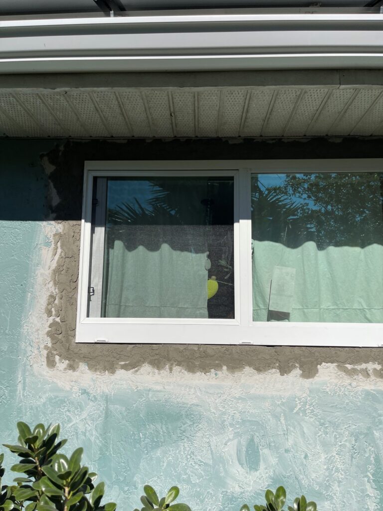 stucco around windows of house