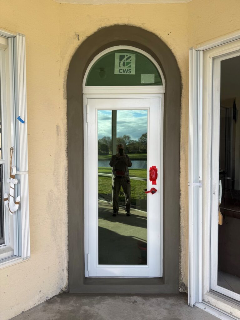 Stucco wall surrounding glass door