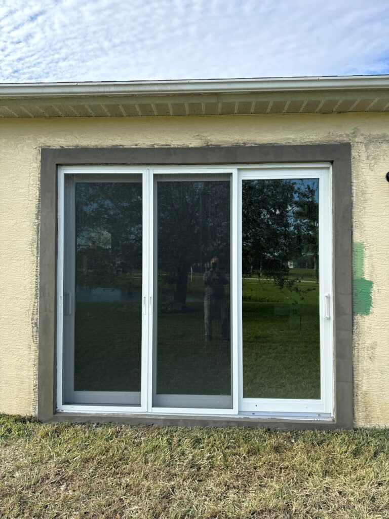 stucco wall surrounding glass door